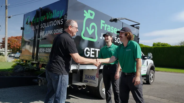 Fraser Valley Junk Removal team shaking hands with a happy customer