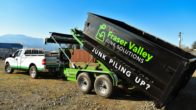 a driveway-friendly bin rental being completed on a nice day in Chilliwack