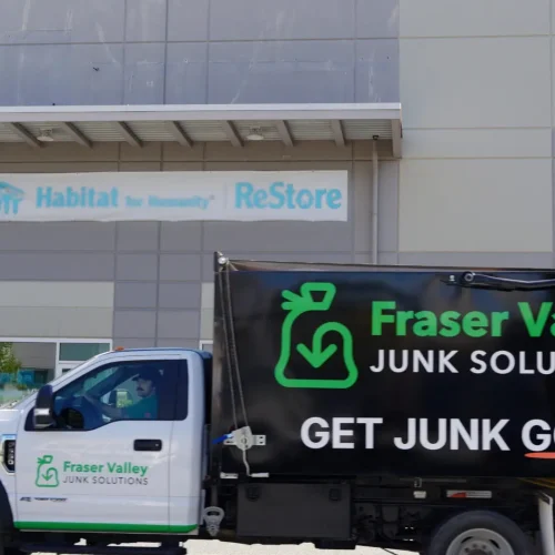 commercial-junk-removal A FVJS truck driving through the parking lot of a commercial stripmall in Chilliwack